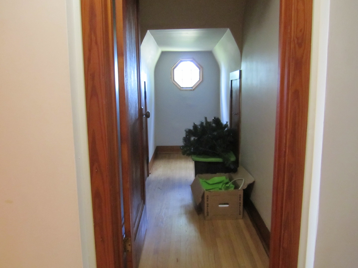 38 Highway Maple Park, IL 60151 - Photo 16 of 29 a view of a hallway with wooden floor and a potted plant