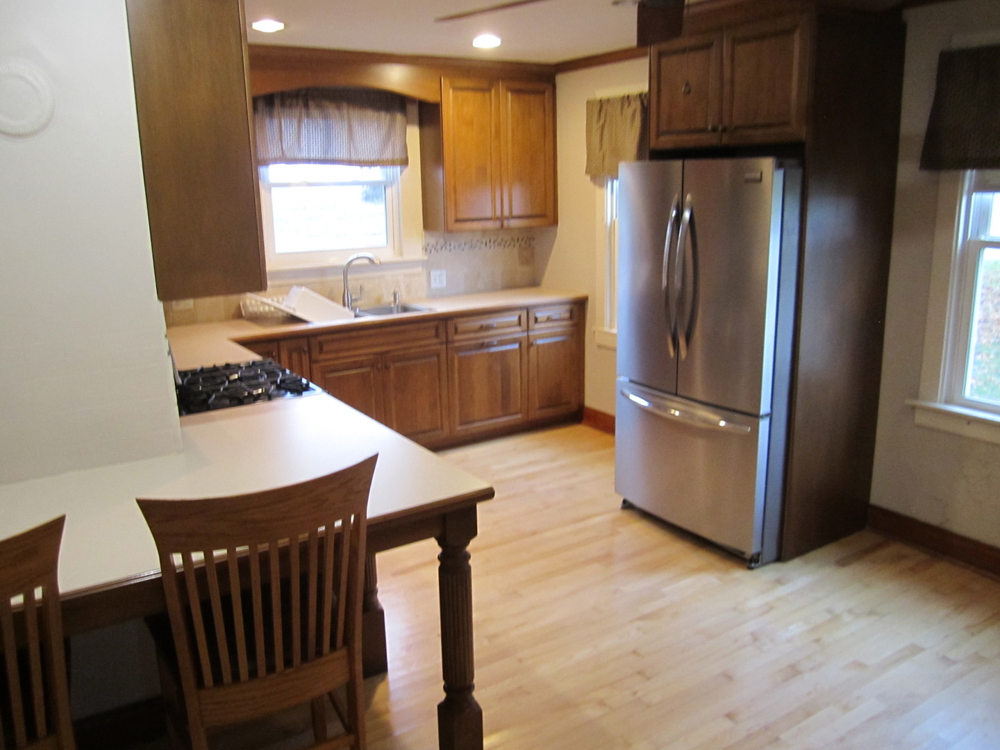 38 Highway Maple Park, IL 60151 - Photo 20 of 29 a kitchen with stainless steel appliances granite countertop a refrigerator a sink a stove and island