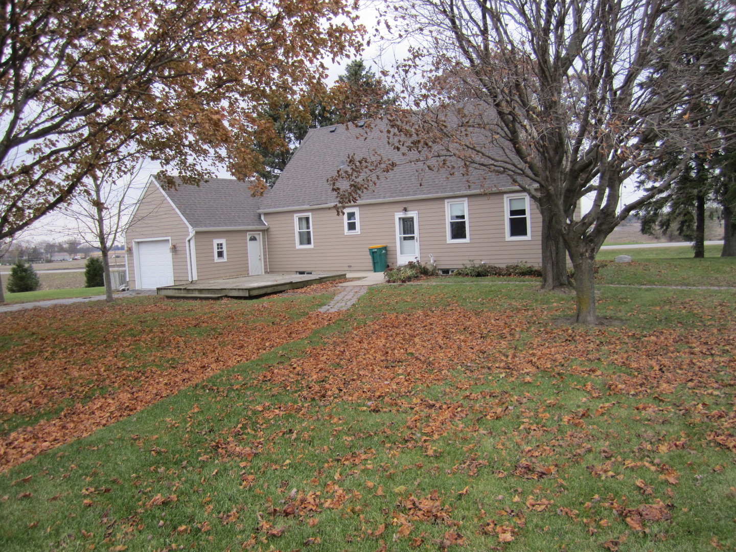 38 Highway Maple Park, IL 60151 - Photo 10 of 29 a front view of a house with a yard and large trees