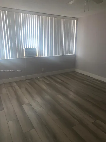 a white toilet sitting next to a white sink