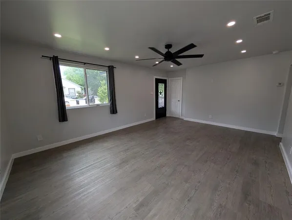 a view of a refrigerator in kitchen and wooden floor
