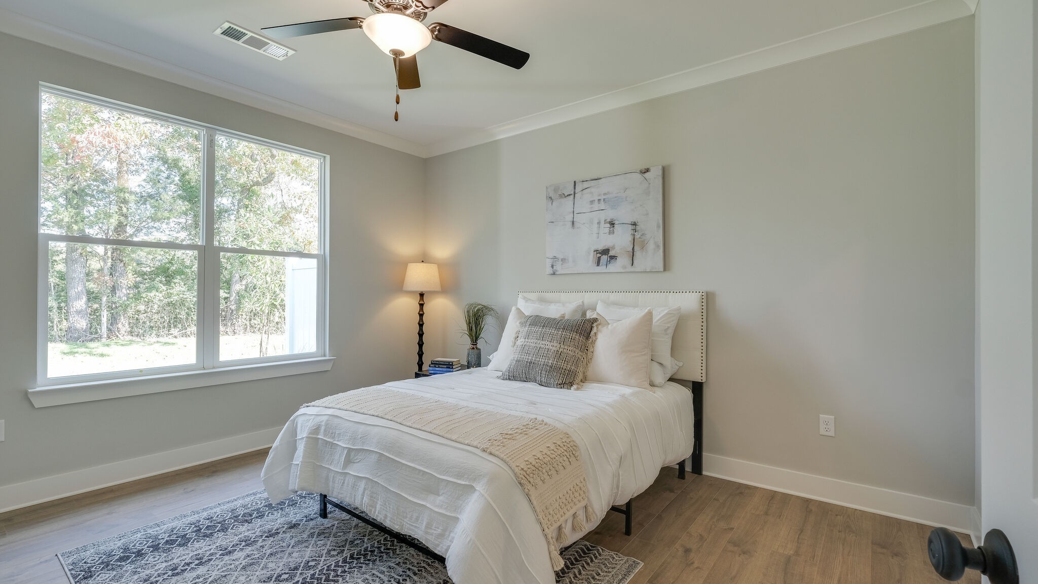 91 Camrose Way Murfreesboro, TN 37128 - Photo 15 of 25 a bedroom with a large bed and a chandelier
