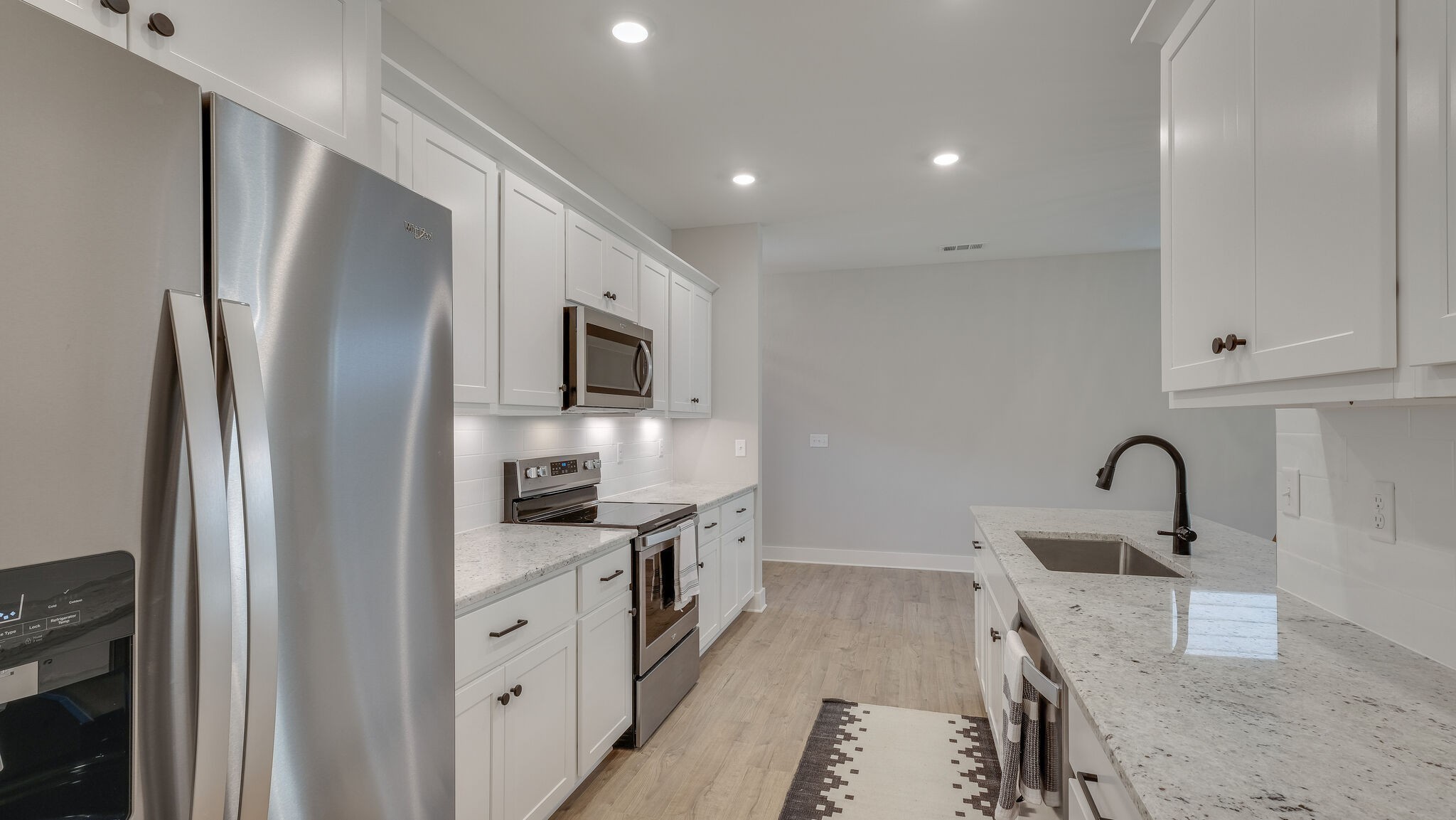 91 Camrose Way Murfreesboro, TN 37128 - Photo 9 of 25 a kitchen with stainless steel appliances granite countertop a refrigerator and a sink