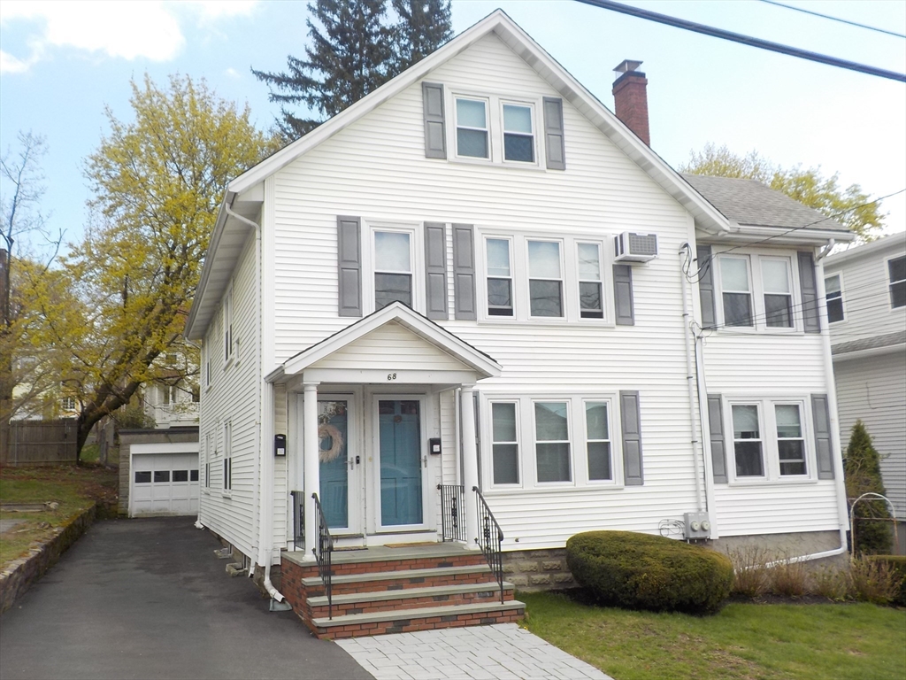 68 Bradford Road Watertown, MA 02472 - Photo 1 of 42 a front view of a house with a yard