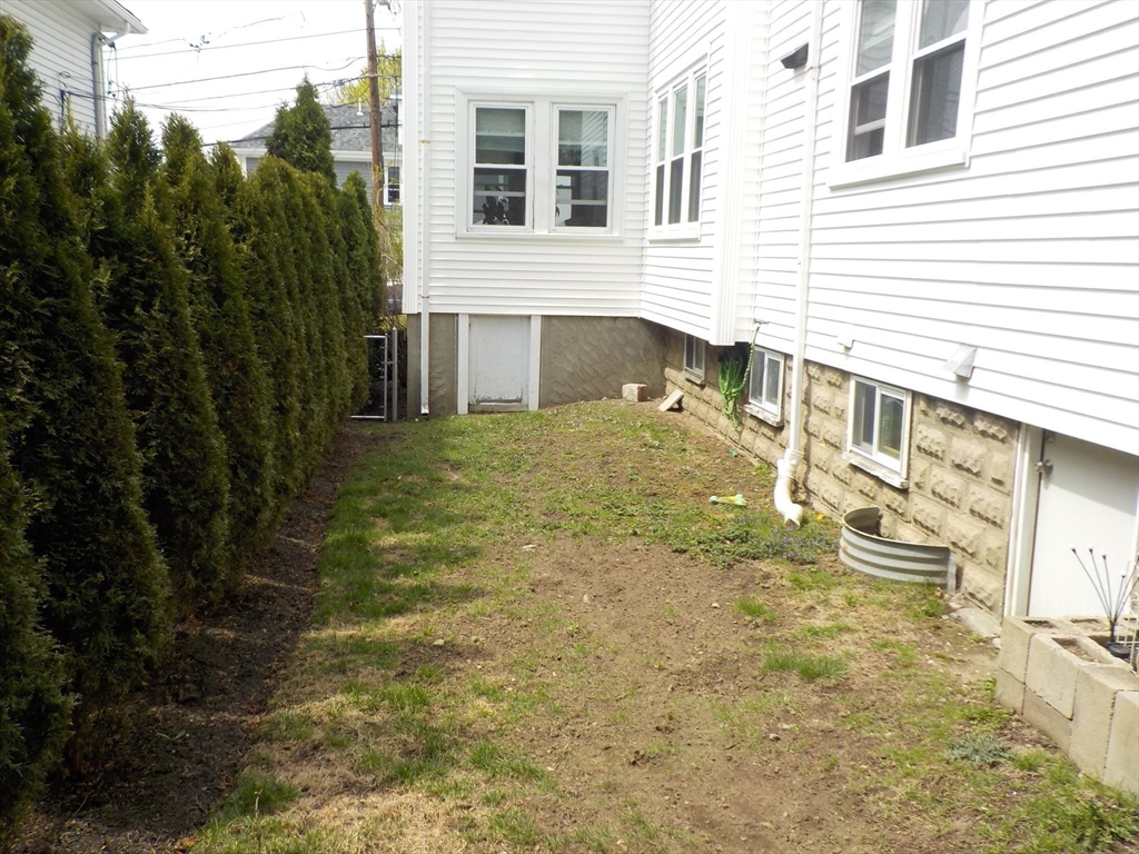 68 Bradford Road Watertown, MA 02472 - Photo 11 of 42 a front view of a house with a yard