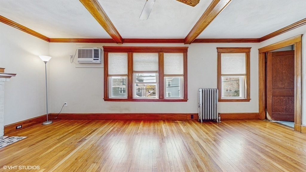 68 Bradford Road Watertown, MA 02472 - Photo 16 of 42 a view of empty room with wooden floor and fan