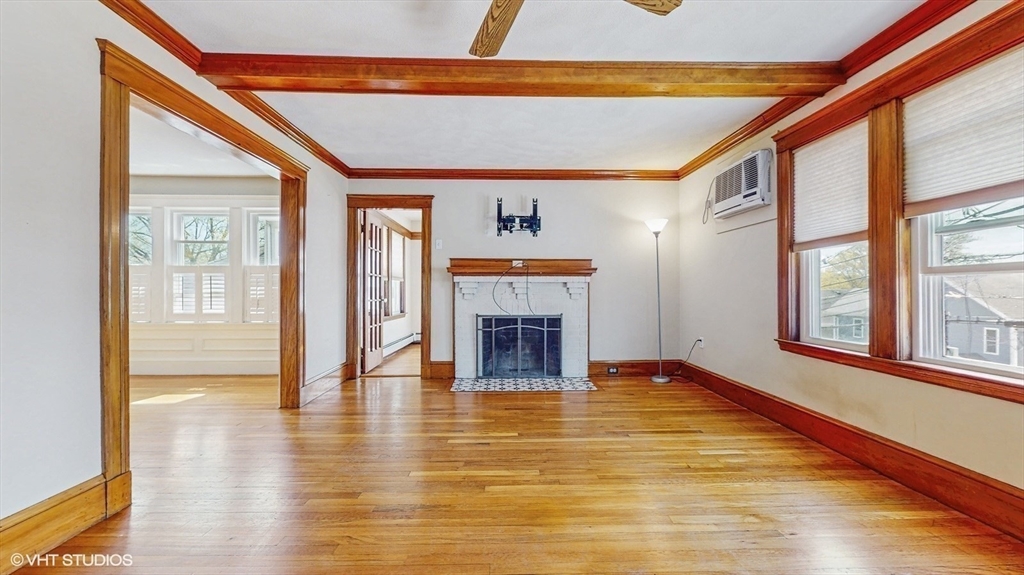 68 Bradford Road Watertown, MA 02472 - Photo 17 of 42 a view of an empty room with a window and fireplace