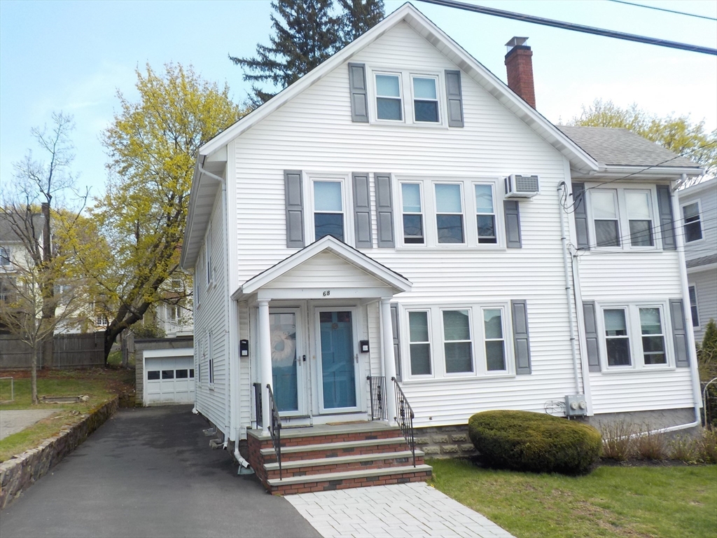 68 Bradford Road Watertown, MA 02472 - Photo 2 of 42 a front view of a house with a garden