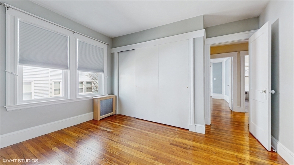 68 Bradford Road Watertown, MA 02472 - Photo 30 of 42 a view of empty room with wooden floor and fan