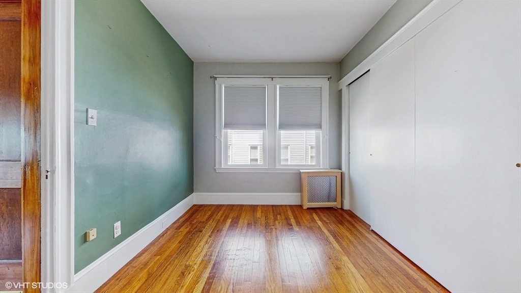 68 Bradford Road Watertown, MA 02472 - Photo 31 of 42 a view of a room with wooden floor and window