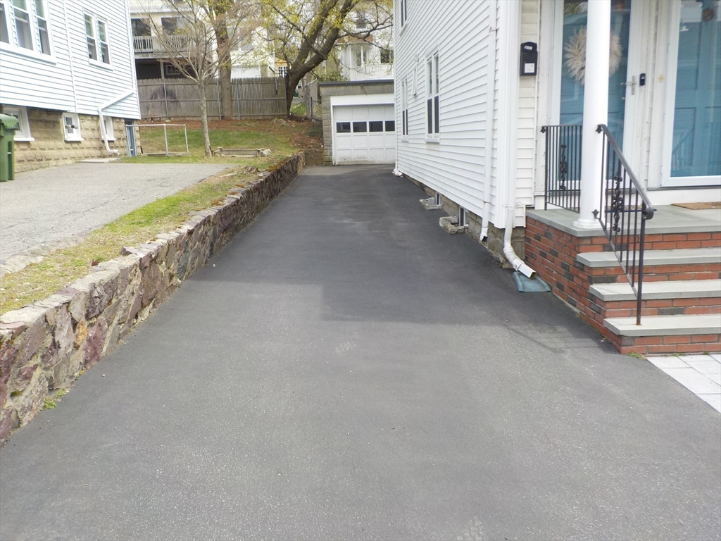 68 Bradford Road Watertown, MA 02472 - Photo 4 of 42 a view of a street with an outdoor seating