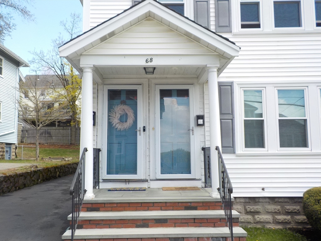 68 Bradford Road Watertown, MA 02472 - Photo 5 of 42 a front view of a house with a porch