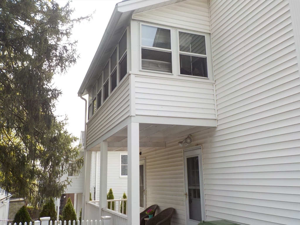 68 Bradford Road Watertown, MA 02472 - Photo 9 of 42 a view of a house with a large window