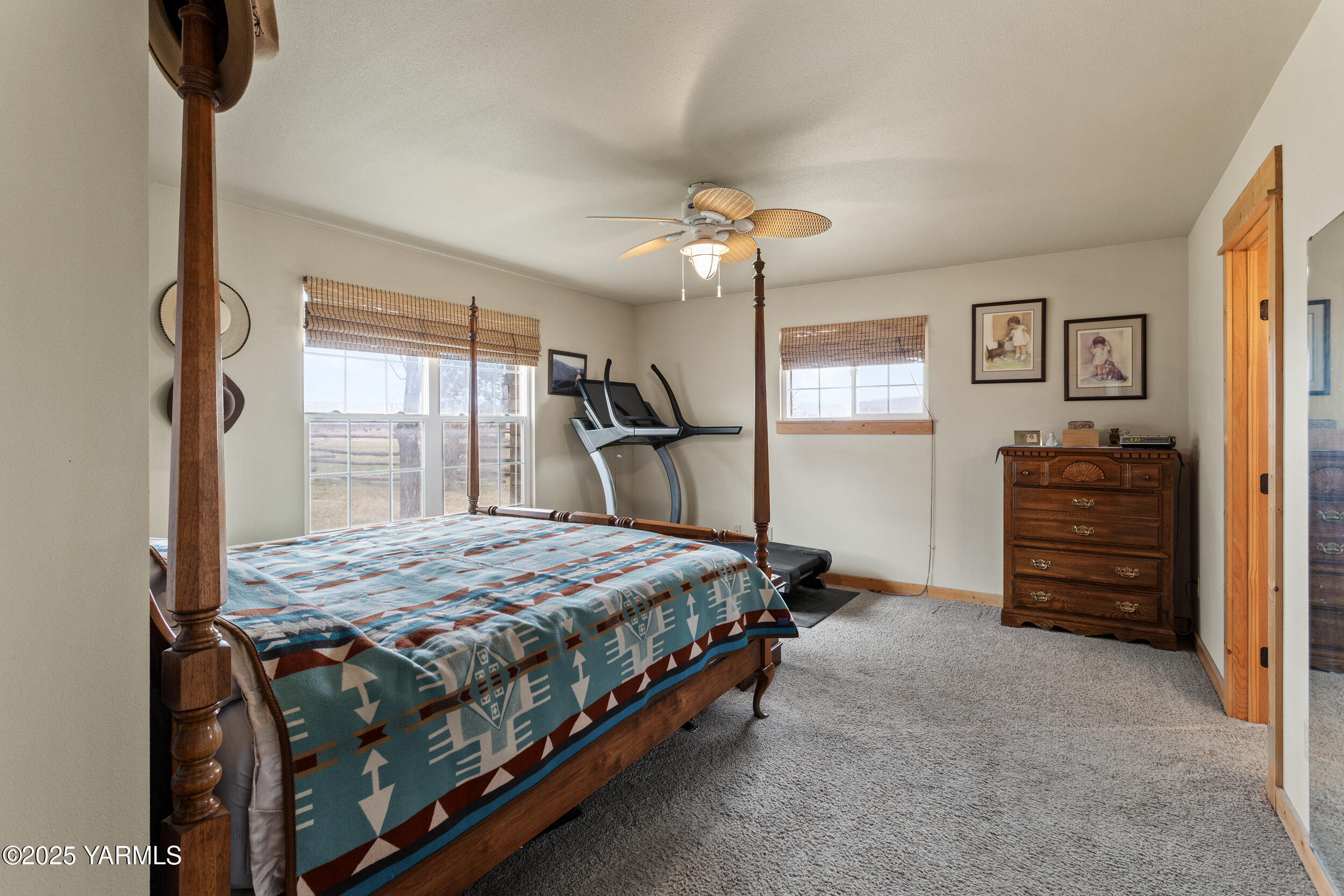 12004 Branch Road Harrah, WA 98933 - Photo 19 of 71 a bedroom with a bed and a chandelier
