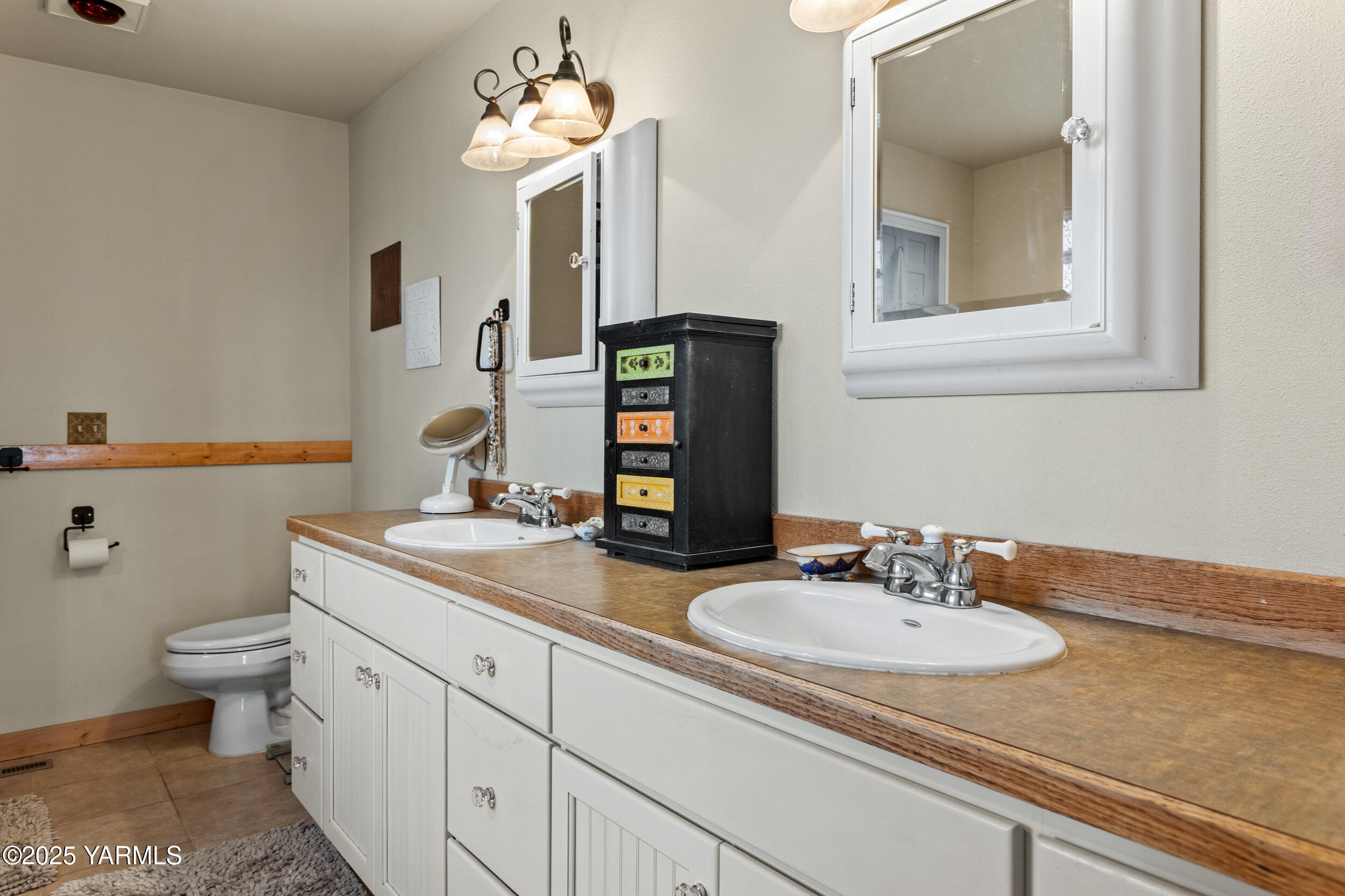 12004 Branch Road Harrah, WA 98933 - Photo 21 of 71 a bathroom with a sink and a mirror