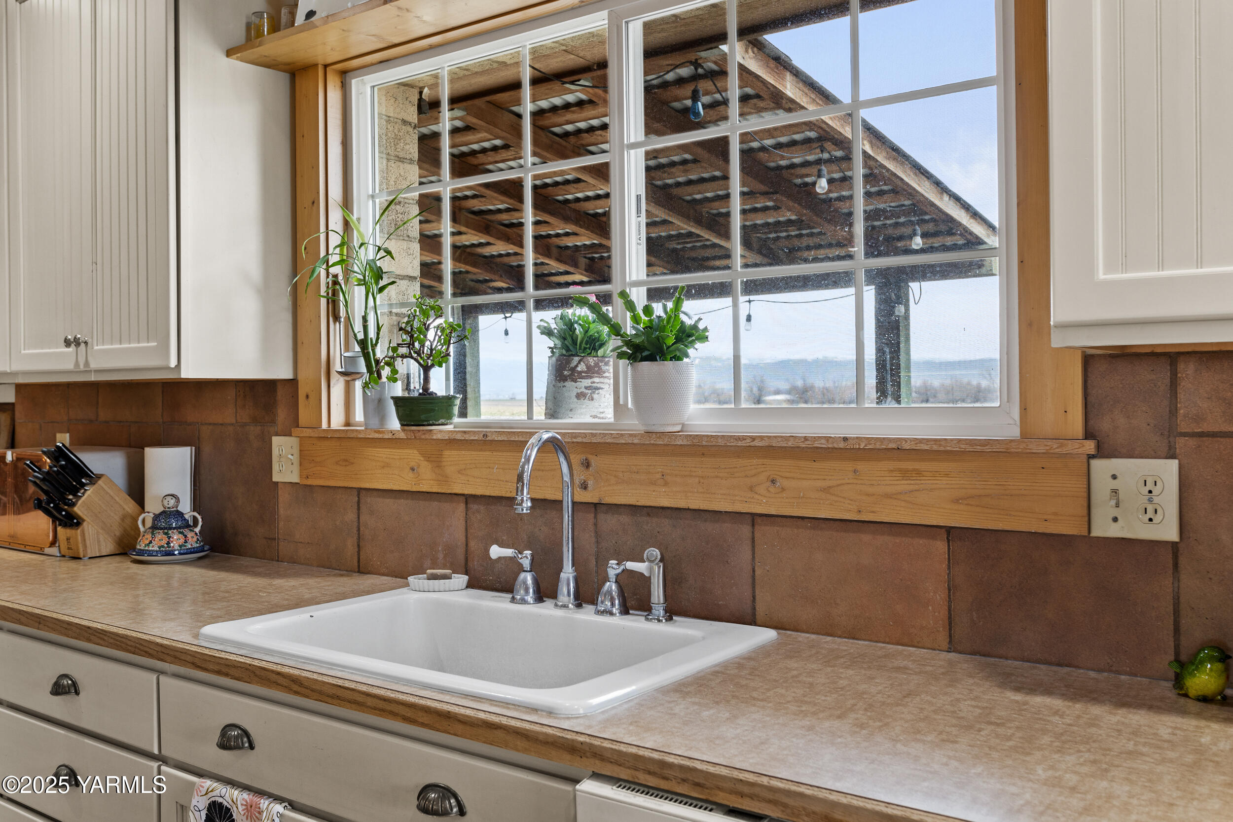 12004 Branch Road Harrah, WA 98933 - Photo 26 of 71 a kitchen with a sink and potted plants