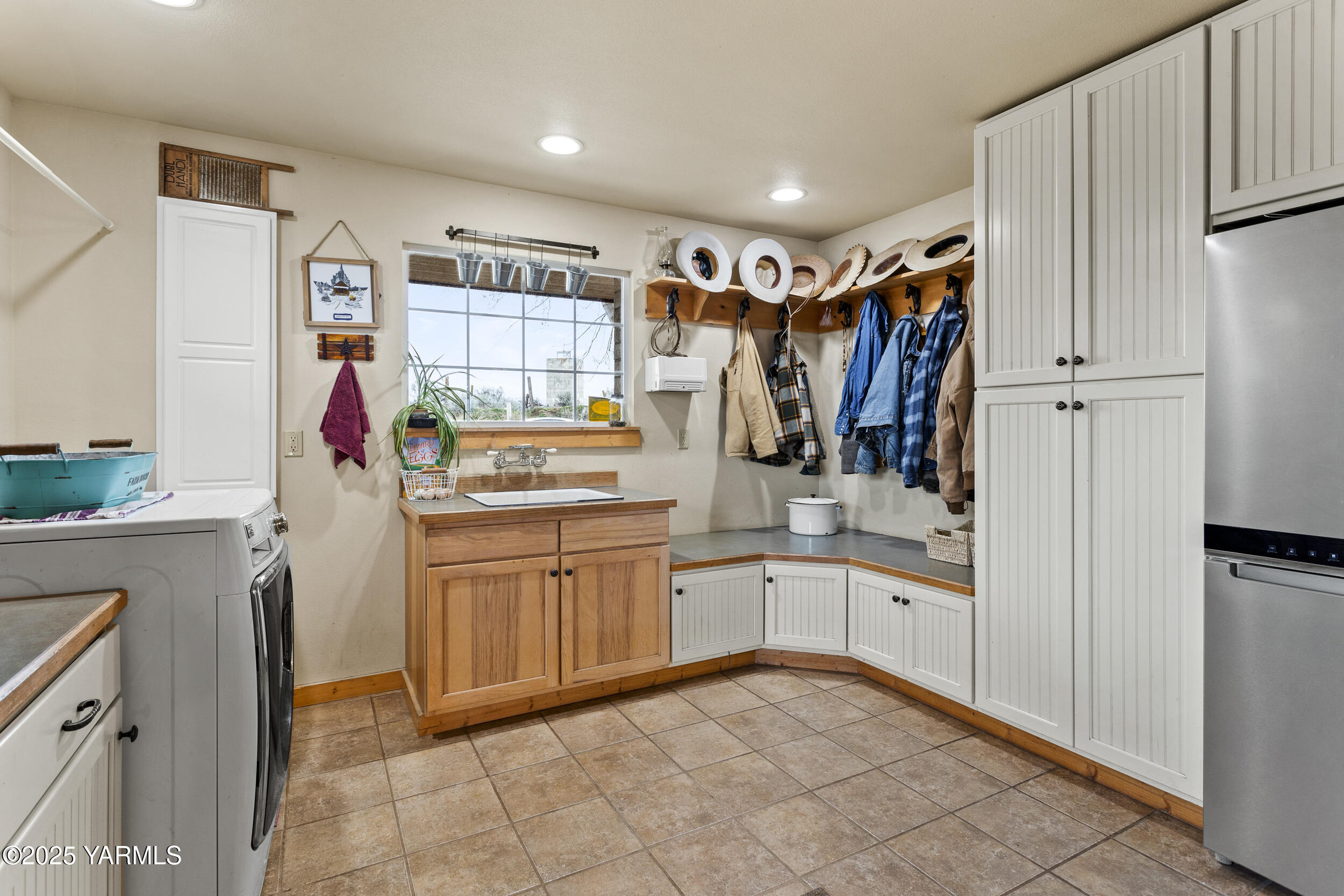 12004 Branch Road Harrah, WA 98933 - Photo 32 of 71 a kitchen with white cabinets and sink