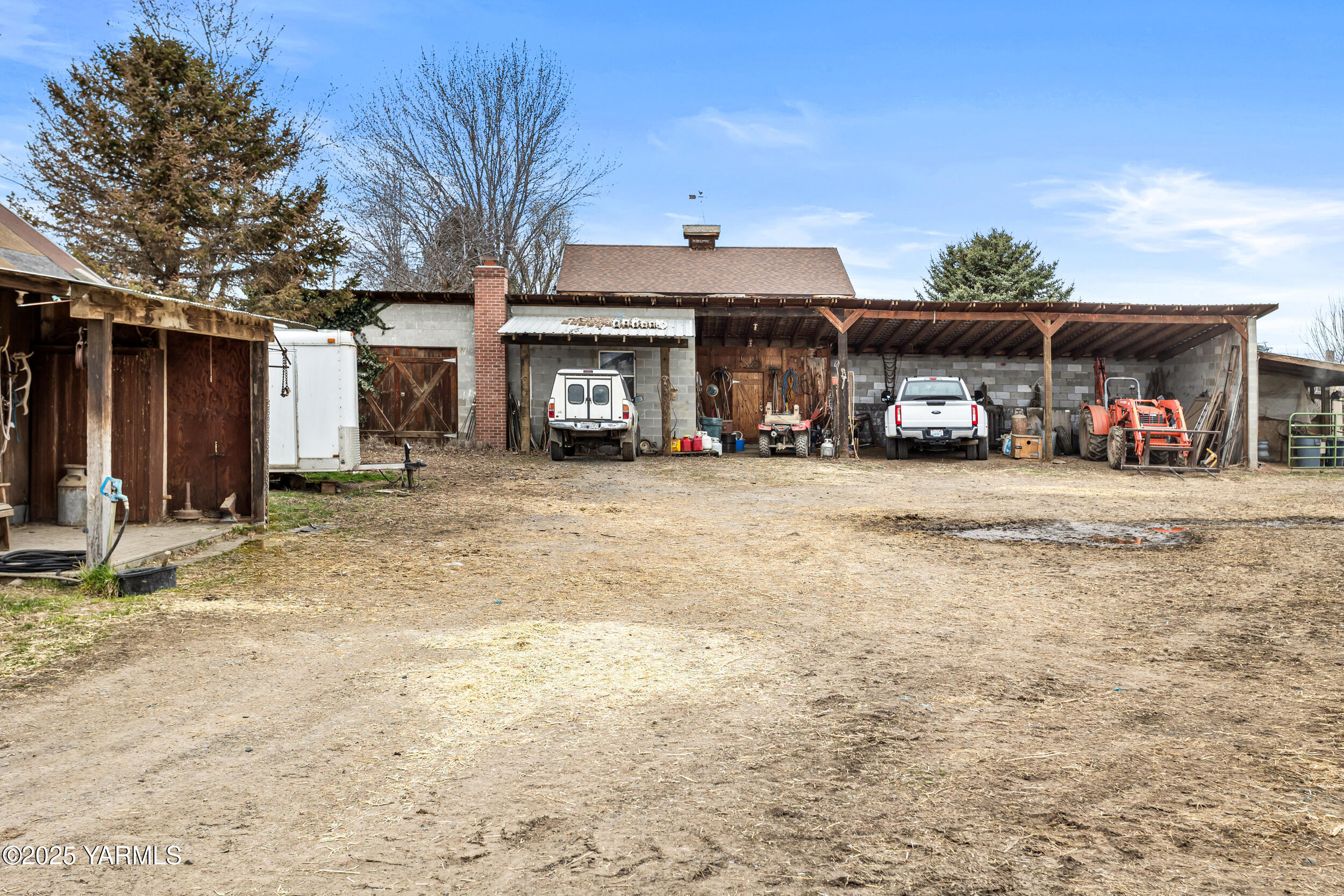 12004 Branch Road Harrah, WA 98933 - Photo 38 of 71 a view of a house with a patio and a yard