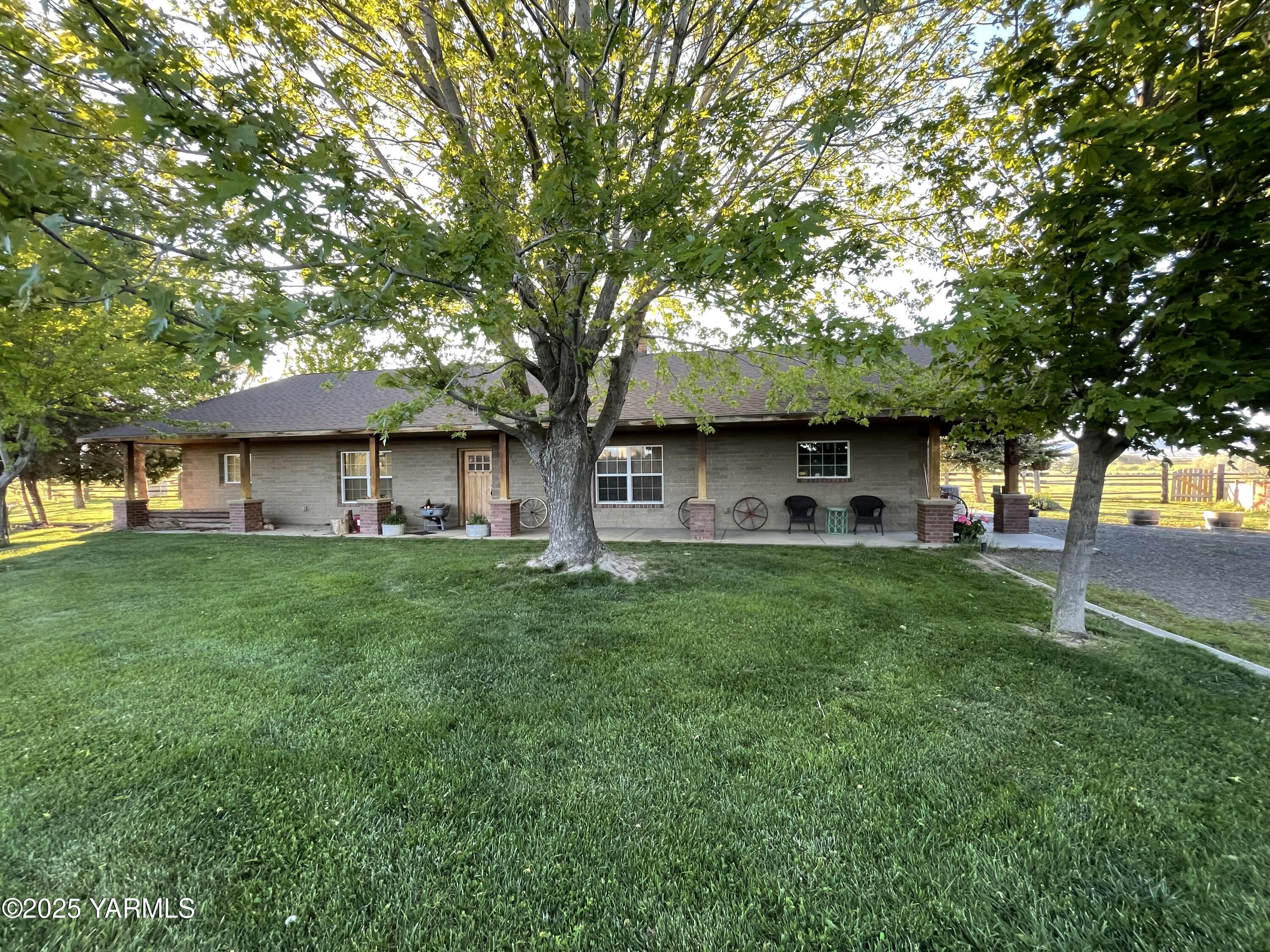 12004 Branch Road Harrah, WA 98933 - Photo 48 of 71 a view of a yard in front of a house with large tree