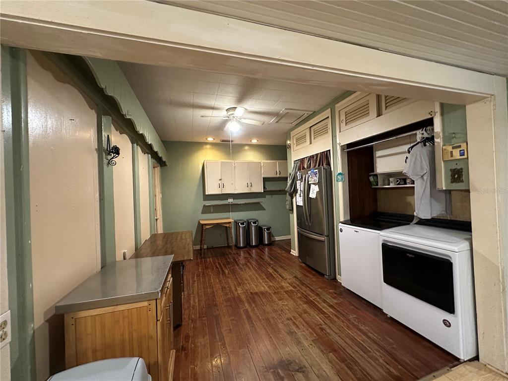 513 West Main Street Wauchula, FL 33873 - Photo 28 of 43 a kitchen with stainless steel appliances a refrigerator and a stove top oven