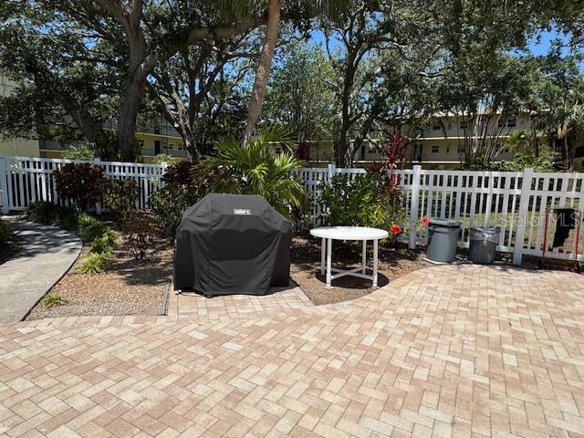11485 Oakhurst Road, Unit 319 Largo, FL 33774 - Photo 60 of 63 a view of backyard with outdoor seating and trees