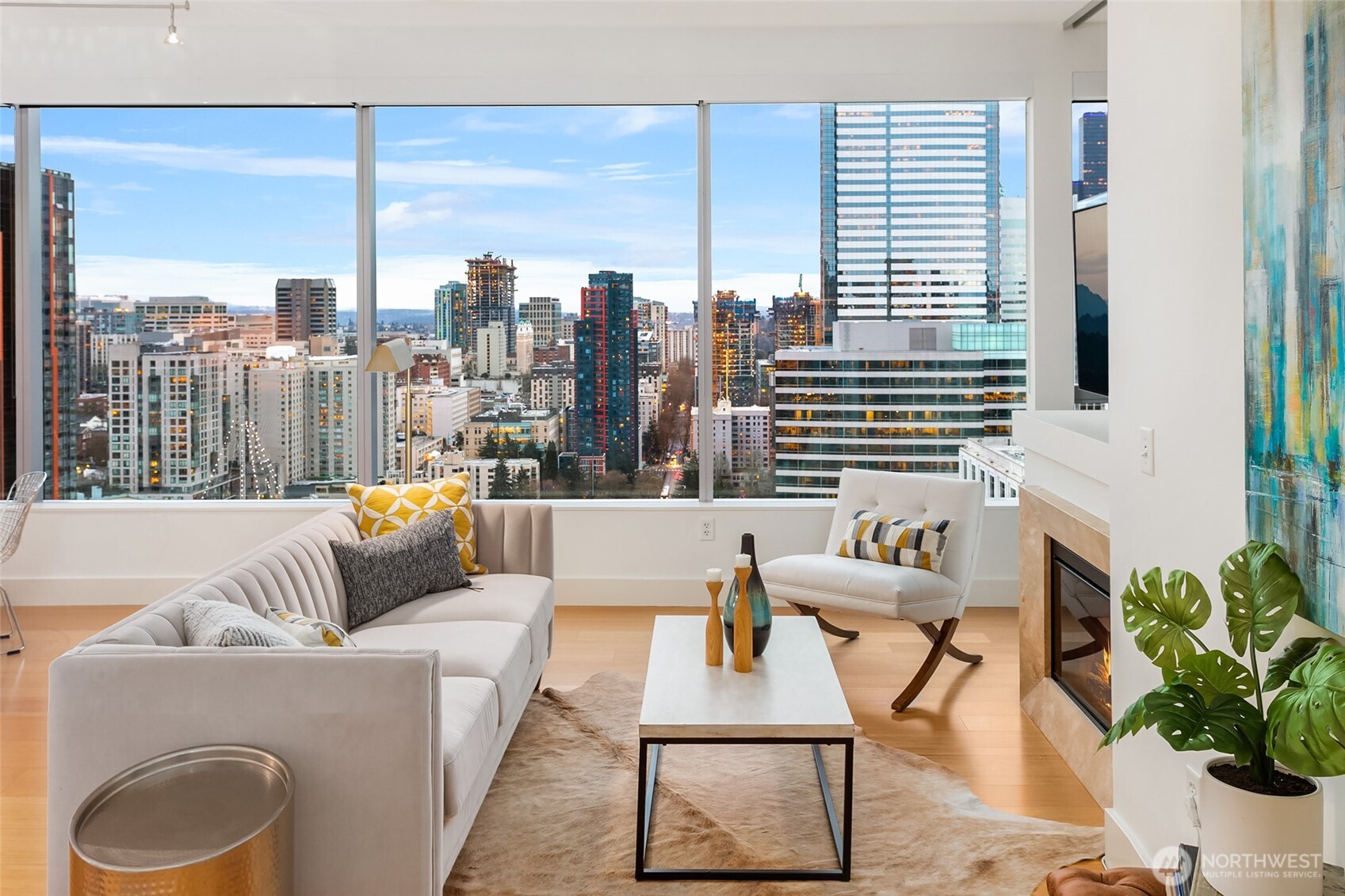 737 Olive Way, Unit 2905 Seattle, WA 98101 - Photo 12 of 38 a living room with furniture and a large window