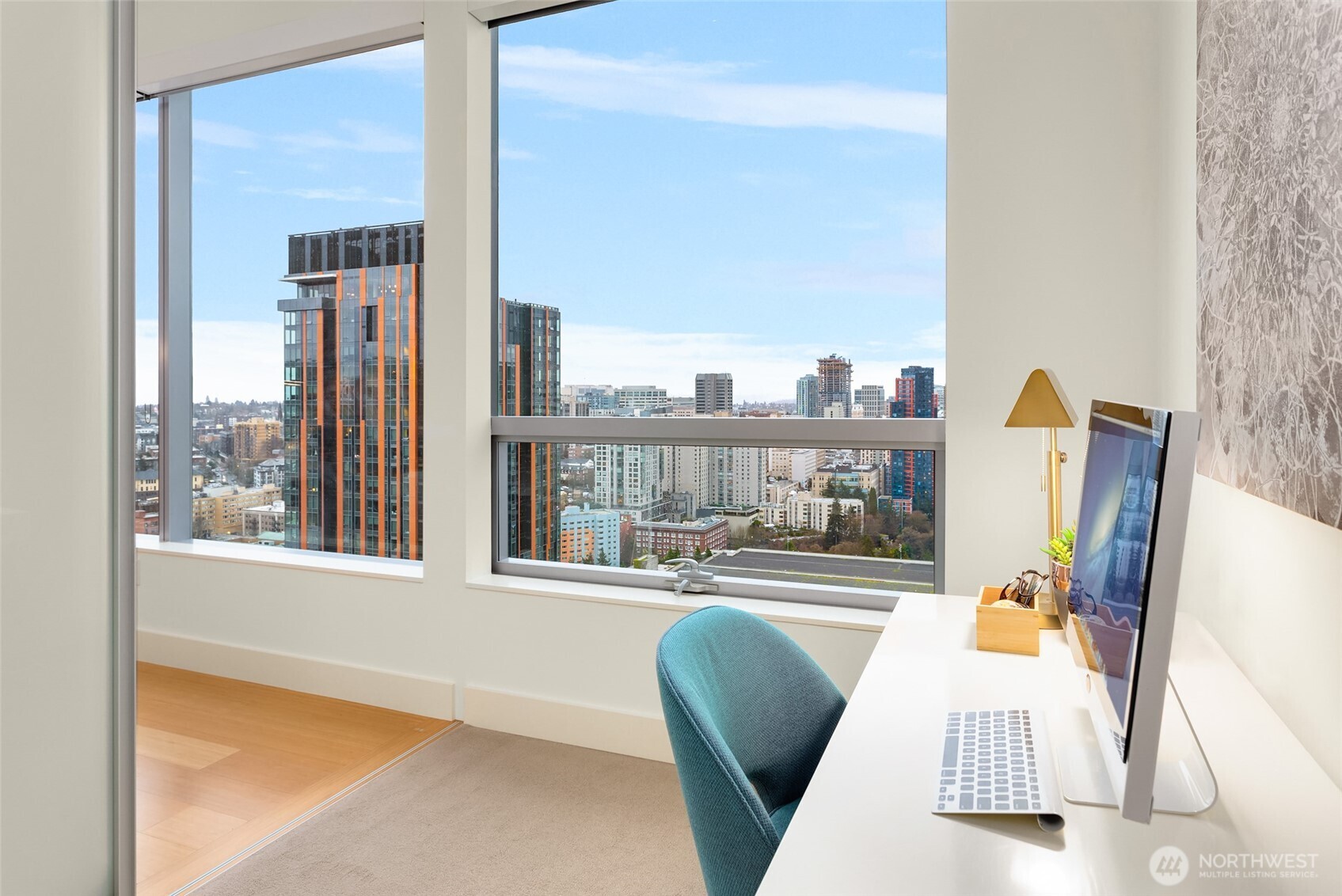 737 Olive Way, Unit 2905 Seattle, WA 98101 - Photo 14 of 38 a living room with furniture and a large window