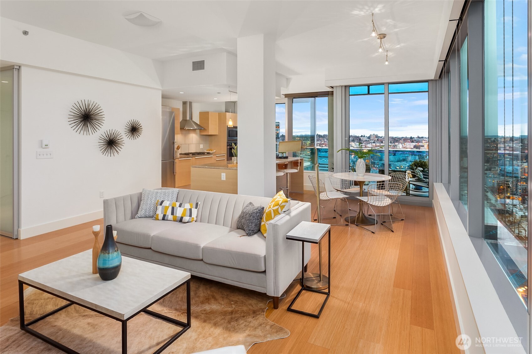 737 Olive Way, Unit 2905 Seattle, WA 98101 - Photo 15 of 38 a living room with furniture and a large window