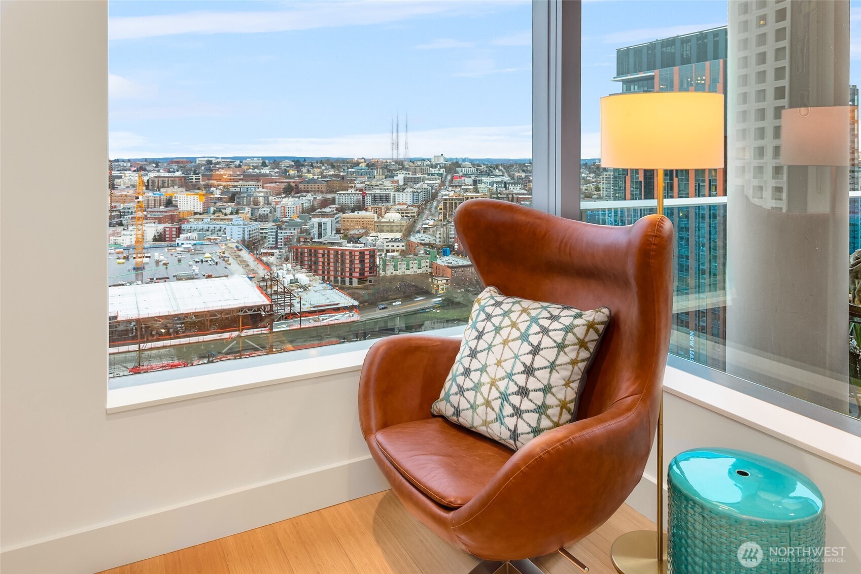 737 Olive Way, Unit 2905 Seattle, WA 98101 - Photo 16 of 38 a view of a living room with a large window