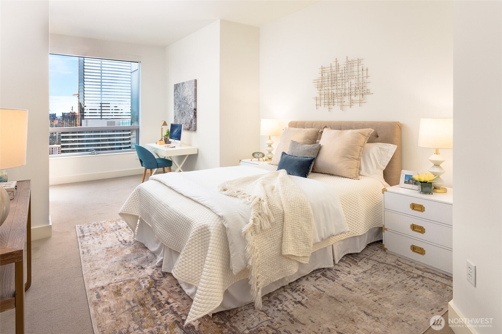 737 Olive Way, Unit 2905 Seattle, WA 98101 - Photo 17 of 38 a spacious bedroom with a bed and a window