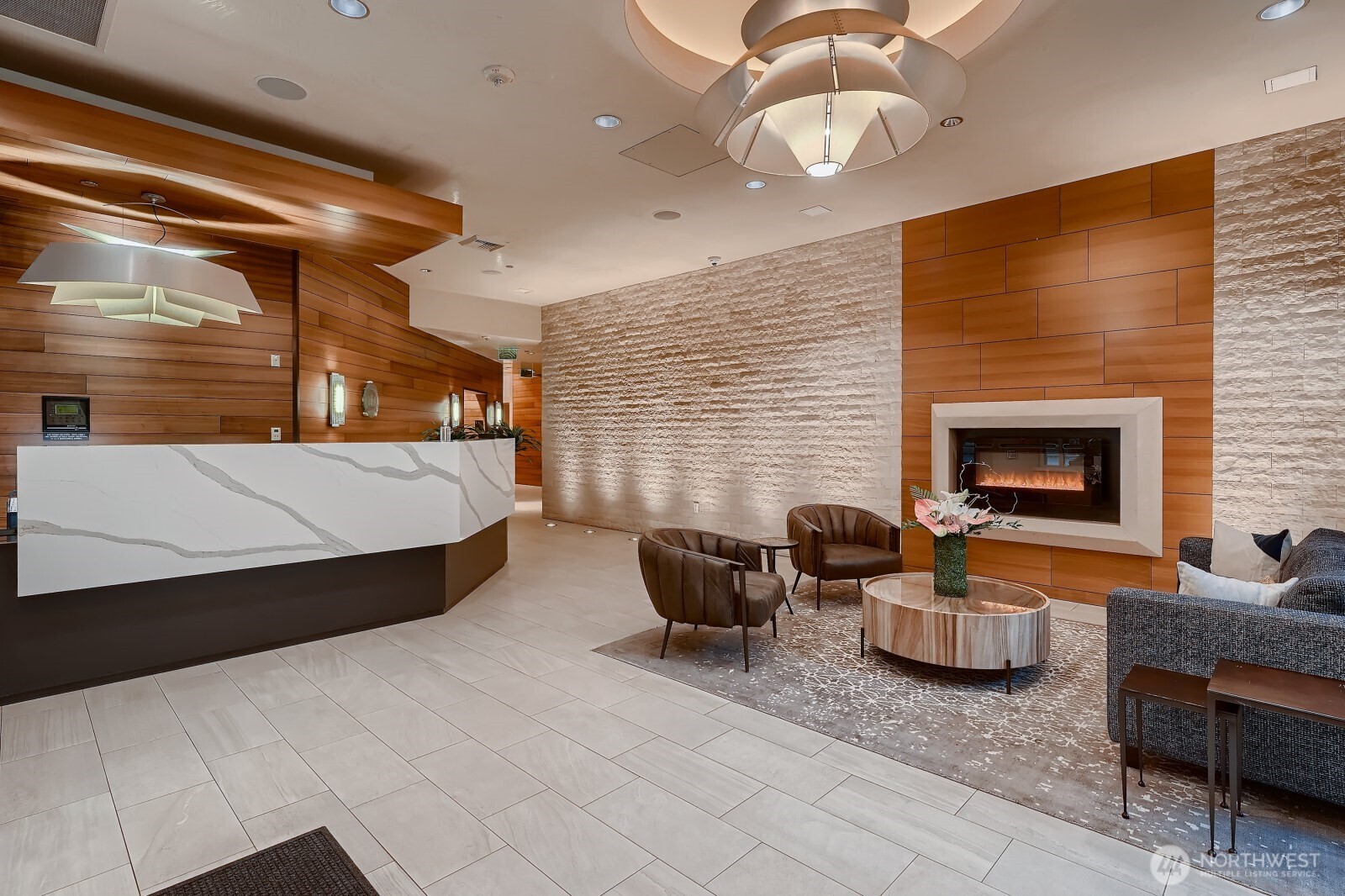 737 Olive Way, Unit 2905 Seattle, WA 98101 - Photo 7 of 38 a living room with furniture and a fireplace