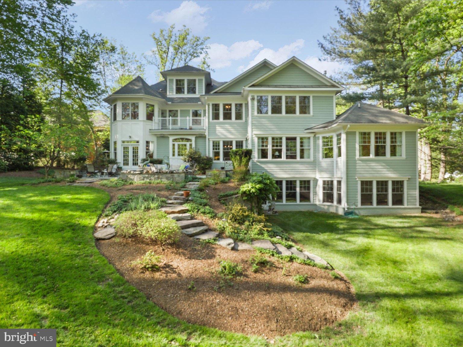 1889 Virginia Avenue McLean, VA 22101 - Photo 4 of 42 a front view of a house with a garden