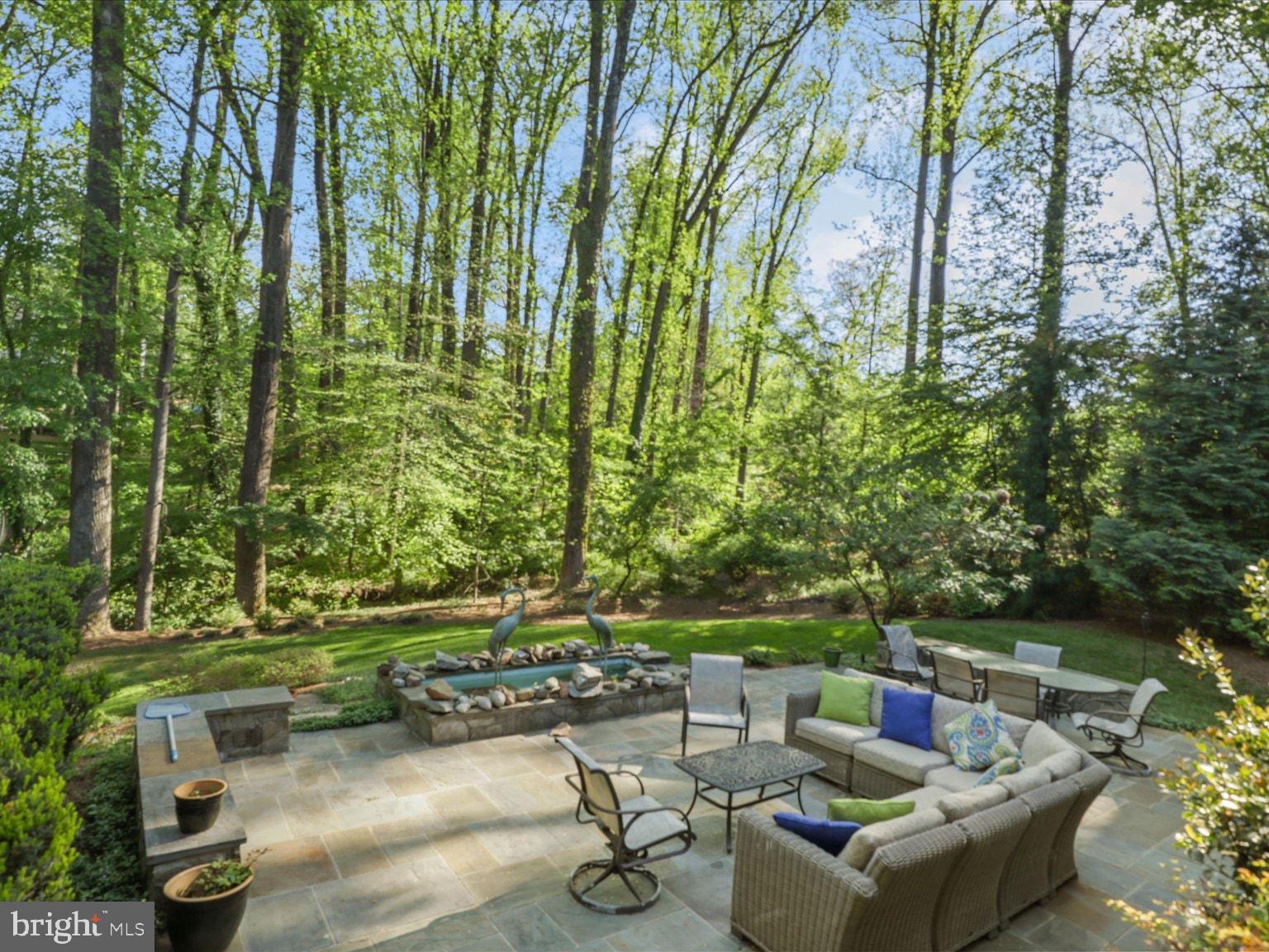1889 Virginia Avenue McLean, VA 22101 - Photo 6 of 42 a view of a patio with couches table and chairs and potted plants