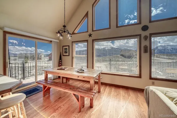 a view of staircase with railing and a floor to ceiling window