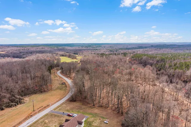 a view of a field with an ocean