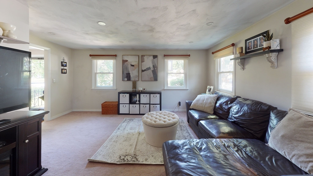 37 Centre Street Natick, MA 01760 - Photo 5 of 8 a living room with furniture and a window
