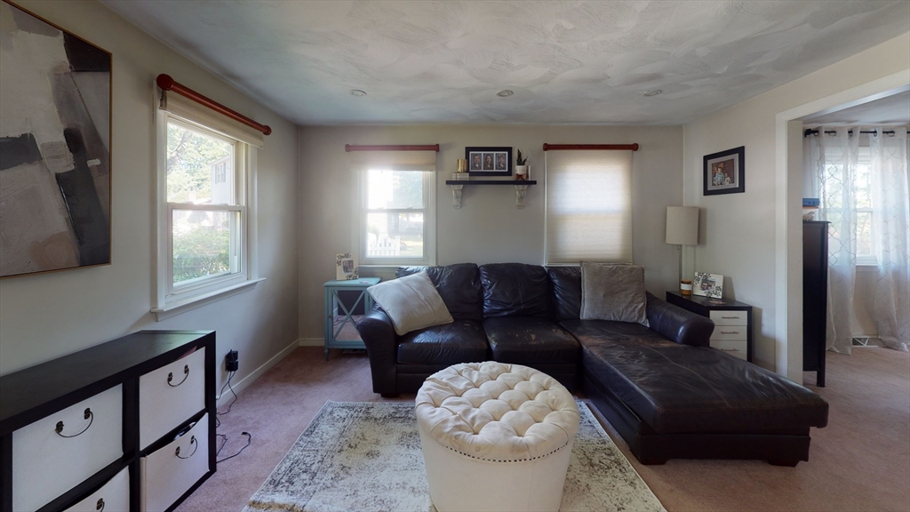 37 Centre Street Natick, MA 01760 - Photo 6 of 8 a living room with furniture and a window