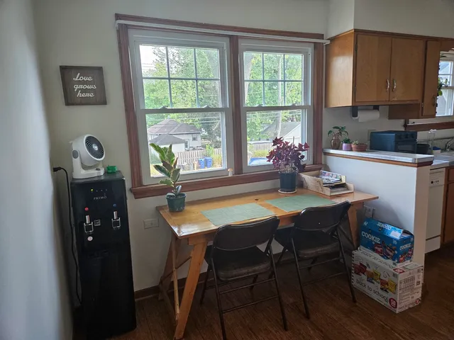 a dining room with furniture and window