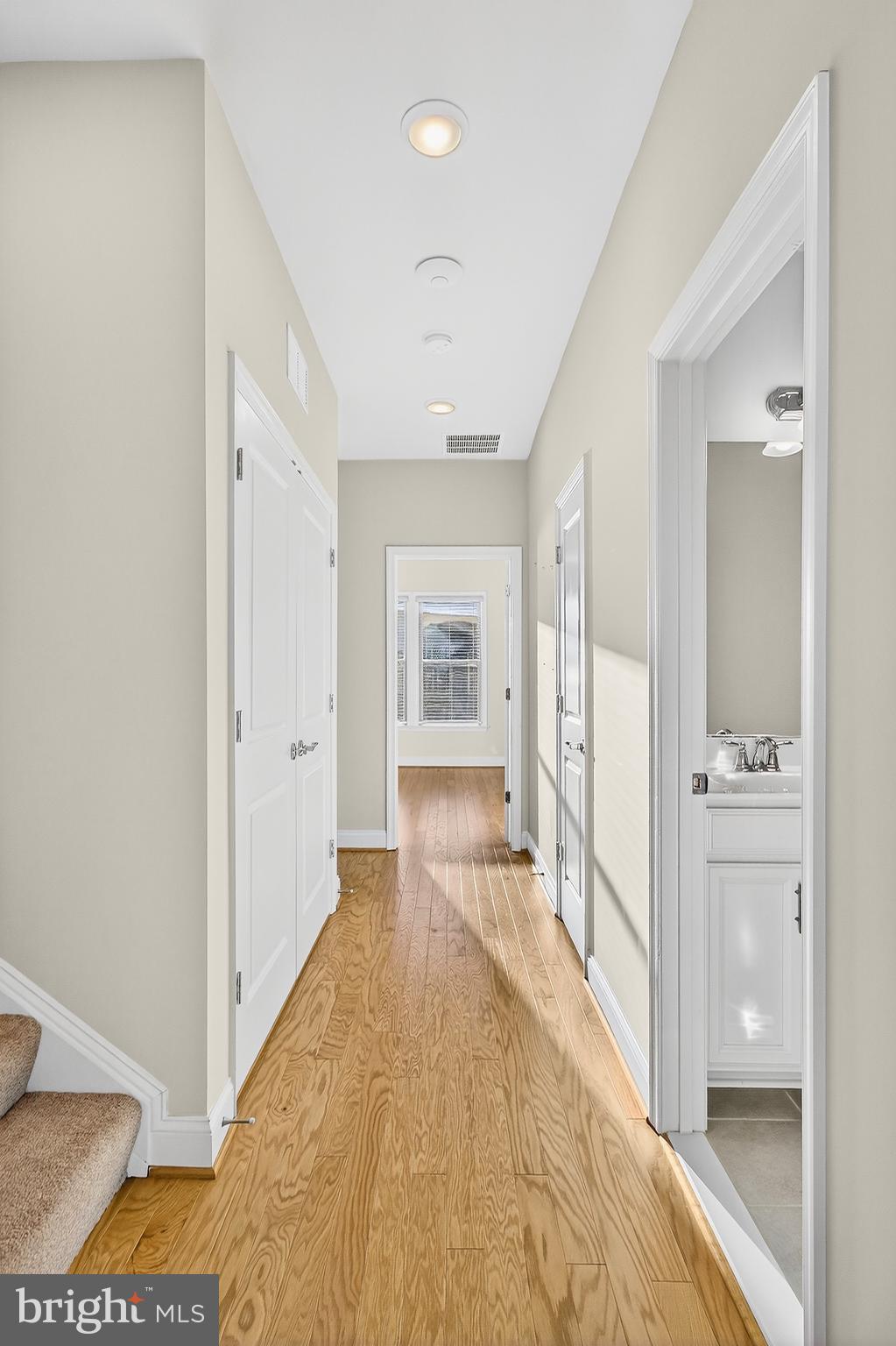17161 Branched Oak Road Dumfries, VA 22026 - Photo 13 of 28 a view of a hallway with wooden floor and cabinet