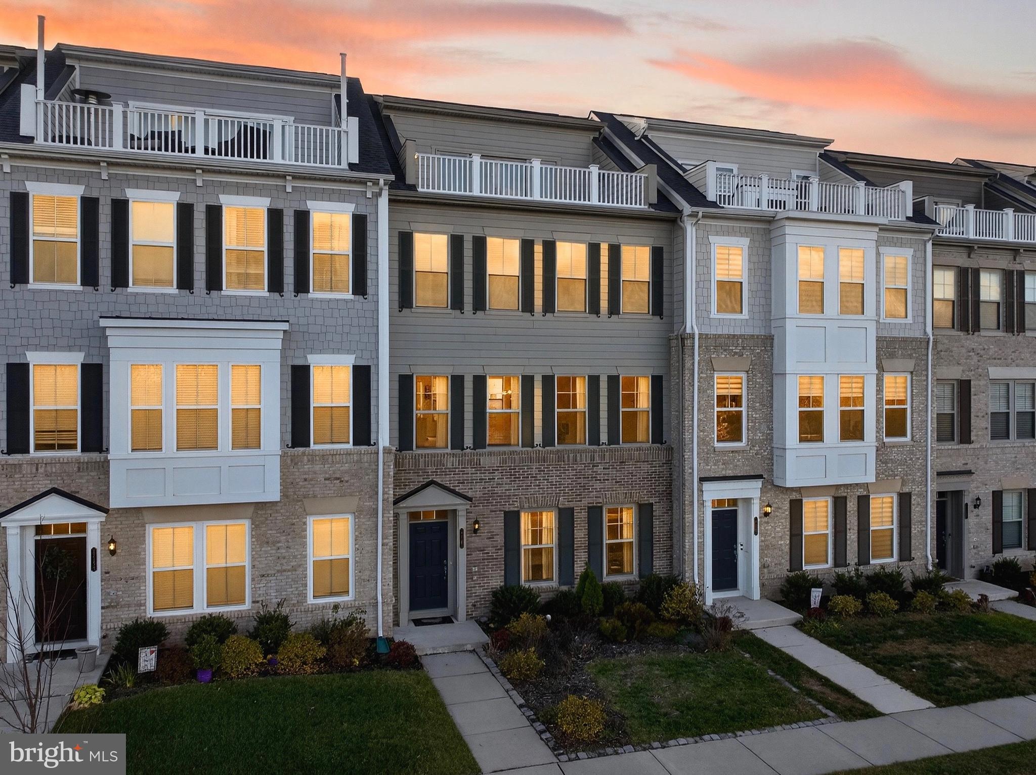 17161 Branched Oak Road Dumfries, VA 22026 - Photo 27 of 28 a front view of a residential apartment building with a yard