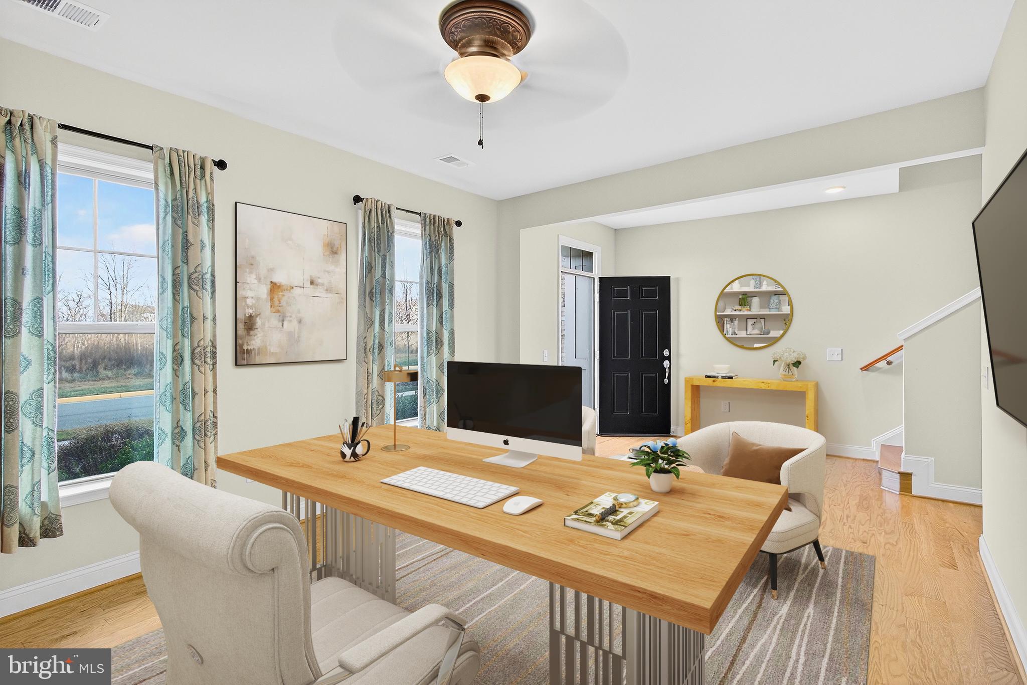 17161 Branched Oak Road Dumfries, VA 22026 - Photo 6 of 28 a view of a dining room with furniture and a large window