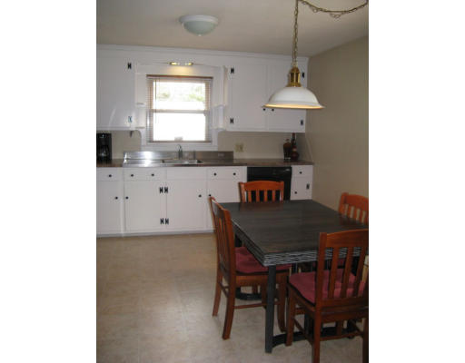 72 Oak Hollow Road Springfield, MA 01128 - Photo 13 of 14 a kitchen with a table and chairs in it
