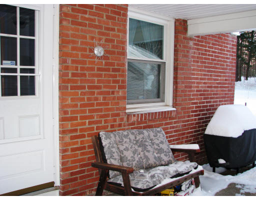 72 Oak Hollow Road Springfield, MA 01128 - Photo 2 of 14 a brick house with table and chairs