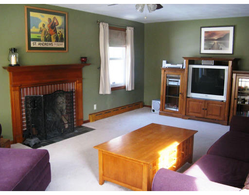 72 Oak Hollow Road Springfield, MA 01128 - Photo 6 of 14 a living room with furniture and a flat screen tv