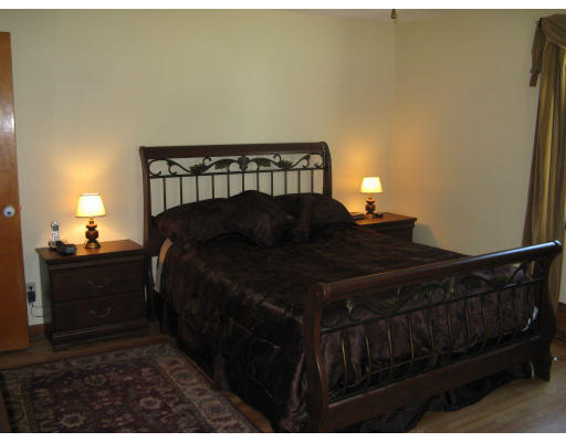 72 Oak Hollow Road Springfield, MA 01128 - Photo 8 of 14 a bedroom with a bed window and a night stand