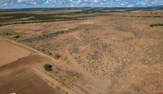a view of water heater and room with yard in back