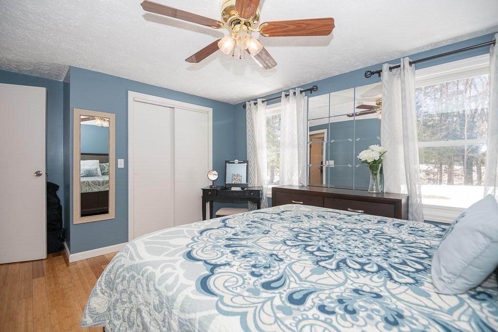 112 Barre Paxton Road Rutland, MA 01543 - Photo 19 of 36 a bedroom with a large bed and a window
