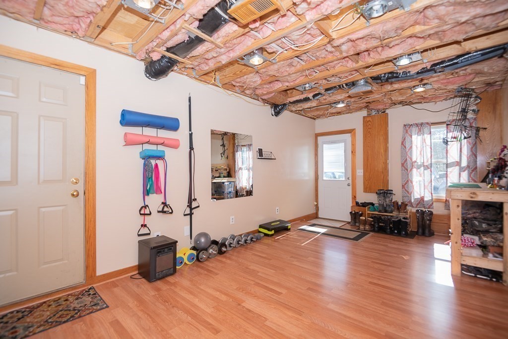 112 Barre Paxton Road Rutland, MA 01543 - Photo 25 of 36 a view of a room with wooden floor and furniture