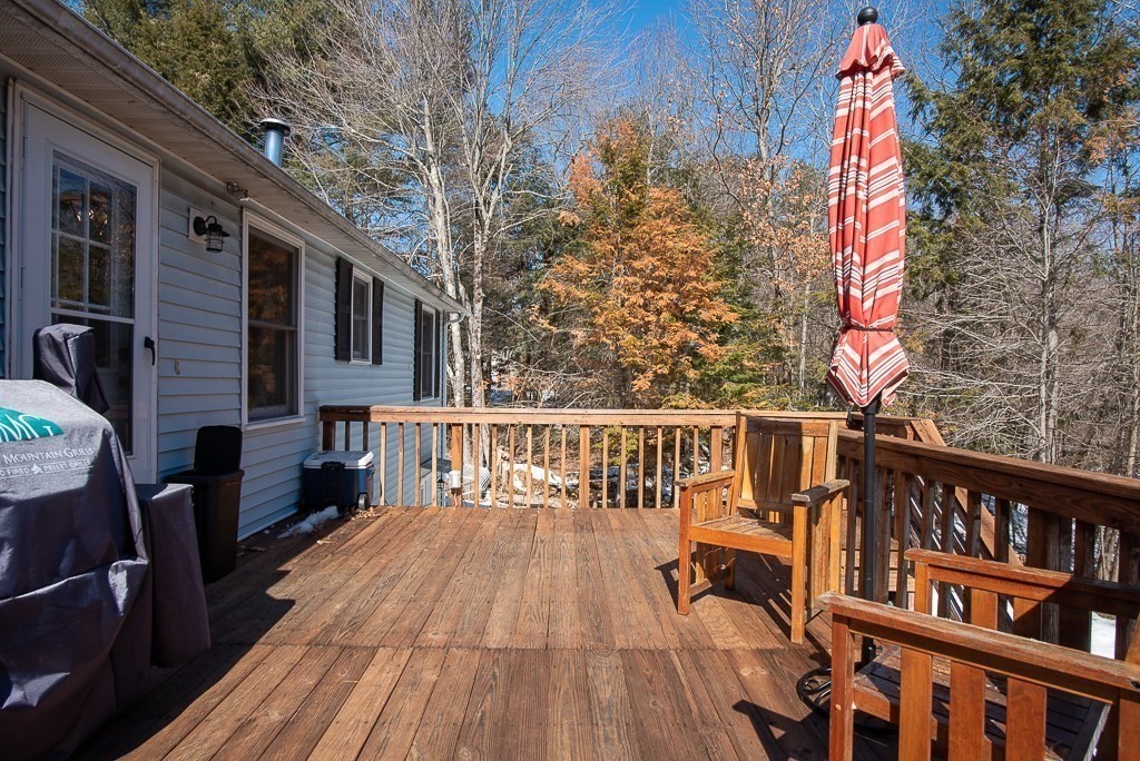 112 Barre Paxton Road Rutland, MA 01543 - Photo 31 of 36 a view of a roof deck with wooden floor and furniture