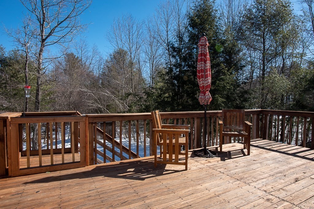 112 Barre Paxton Road Rutland, MA 01543 - Photo 33 of 36 a view of deck with wooden floor and seating space